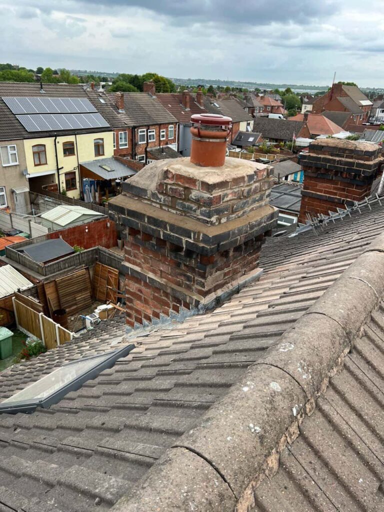 This is a photo taken from a roof which is being repaired by Hinckley Roofing Repairs, it shows a street of houses, and their roofs